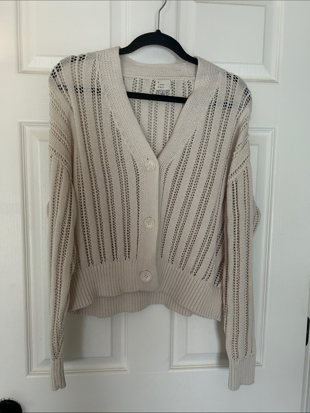 Cream cardigan.